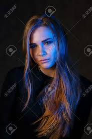 So, black and blonde hair belongs to the category of universal styles that ladies have ever played around with. Blonde With Long Hair In Black Poses In Black Studio With Blue Stock Photo Picture And Royalty Free Image Image 86193658