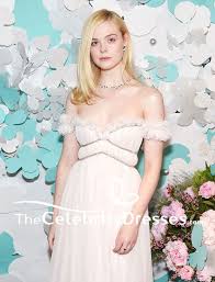 With a thick cloud of fog billowing over central park, tiffany and spotify threw a raging rap concert on the roof of their fifth avenue building. Elle Fanning White Evening Dress Tiffany Co Paper Flowers Event And Believe In Dreams Campaign Launch Thecelebritydresses