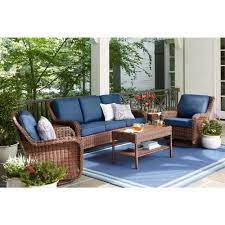 Hampton Bay Cambridge Brown Wicker Outdoor Patio Swivel Rocking Chair With Standard Midnight Navy Blue Cushions 65 17148b4 The Home Depot Used Outdoor Furniture Backyard Furniture Resin Wicker Patio Furniture