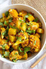 Baked Aloo Gobi Vegan Recipe Indian Spiced Potato Cauliflower Vegan Richa Recipe Aloo Gobi Vegan Recipes Indian Food Recipes