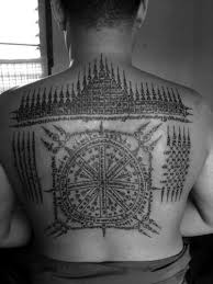 'khmer script' tattoo on her left shoulder. Phoenix Voyages Tatoo Monk Cambodia