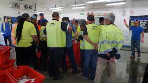 Busy day at AJ Langford's market city Perth.Where we have supplied fish too  for 4 generations. With buyers crowd around out there fishin, fresh fish  bid hard boys