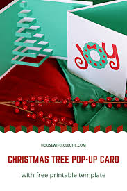 First fold the smaller piece of green paper in half and draw half a christmas tree: Homemade Pop Up Christmas Tree Card With Free Printable Template Housewife Eclectic