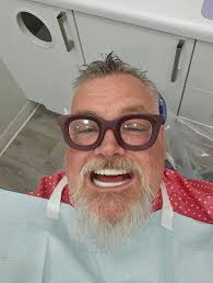 Is it true that one might leave with dentures instead of attached temp  teeth after implant installation? I'm confused over some posts. Thank you!  (My husband has op date scheduled already but