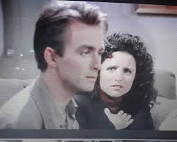 Young man resembling Babu Bhatt from Seinfeld