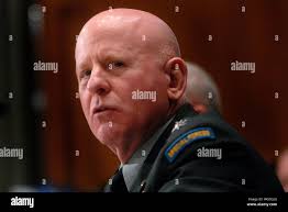 Chief of the National Guard Bureau Gen. Joseph L. Lengyel greets Spc. Jacob  Nutt, a squad leader with 1st Battalion, 128th Infantry, 32nd Infantry  Brigade Combat Team, at Homestead Air Reserve Base,