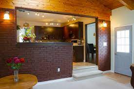 This expansive finished basement features lightly colored carpeting and recessed lighting throughout. Inexpensive Basement Decorating Ideas