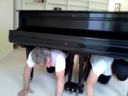 Move a grand piano using a padded moving board after wrapping the piano with moving blankets, tilt the instrument and place it onto the moving board with the long side facing down. How To Move A Baby Grand Piano Youtube