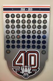 Edmonton oilers wall hanging distressed wooden barn board sign. 2018 19 Edmonton Oilers Locker Room Custom Puck Display With Game Pucks Representing All 35 Oilers Regular Season Home And Road Wins Nhl Auctions