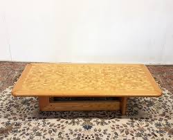 This coffee table is a perfect solution to storing small items, like remotes and books, while still keeping them easily accessible. Light Oak Coffee Table With Mosaic Top Denmark 1960s 133003