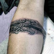 The ouroboros — the image of a snakeor sometimes a dragon or a lizard eating its own tail — has been growing, shedding, and consuming its own skin since the dawn of history. Top 73 Ouroboros Tattoo Ideas 2021 Inspiration Guide Ouroboros Tattoo Armband Tattoo Design Tattoos