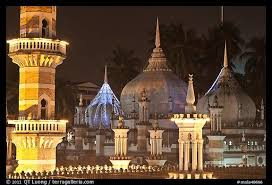 This is the city's oldest mosque, built in the early 1900s and officially opened by the sultan of selangor in 1909. Picture Photo Minarets And Domes At Night Masjid Jamek Kuala Lumpur Malaysia Kuala Lumpur Masjid Islamic Architecture