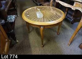 The obtuse profile of this monumental coffee table speaks directly to the tortoise shell or scorched bamboo coffee table. Lot French Oak Round Cane Glass Top Coffee Table