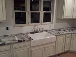 Royal White Granite With White Farm Sink Over White Distressed Cabinets White Granite Granite Kitchen White Distressed Cabinets
