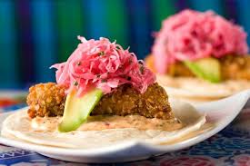 Serve fish in warm tortillas with coleslaw and a drizzle of dipping sauce. Distrito Jose Garces Philadelphia Food Dressed Up Fish Tacos At Distrito Credit Courtesy Of Distrito Food Mexican Food Recipes Raw Food Recipes