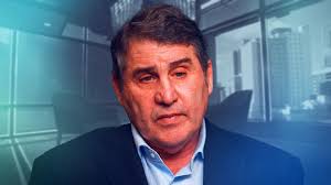 Working 'like there's no tomorrow': Health commissioner defends other role