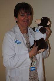 Lisa Associate Administrator Of Palm Beach Children S Hospital Takes A Photo With Our Sweet Monkey Friend Childrens Hospital How To Take Photos Childrens