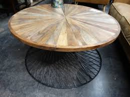 Modern metal base round coffee table. Round Wood And Metal Coffee Table Has A Rustic Industrial Vibe