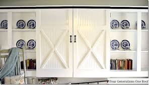 The country white finish adds to the distressed aesthetic; Diy Sliding Barn Doors Our Kitchen Renovation Four Generations One Roof