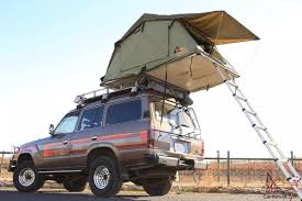 Enjoy the outdoors while staying protected from the sun and rain with a durable, water resistant, and easy to erect tent or awning mounted on your toyota land cruiser. 1988 Turbo Diesel Hj61 With Roof Top Tent