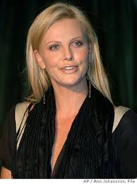 Charlize Theron plans summer wedding; Lohan to testify at parents' trial;  J.Lo's pricey gift to herself