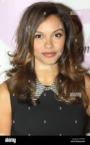 In this March 30, 2013, photo, police officer Andre Nash watches a Windy  City Hoops program basketball game at the Kennicott Park recreation center  as part of his patrol beat in Chicago.
