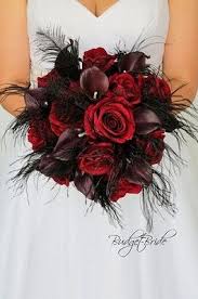 Dark Red And Wine Wedding Flower Brides Bouquet Accented With Black Feathers Perfect For A Gothic We Red Bouquet Wedding Red Wedding Theme Wine Wedding Flowers