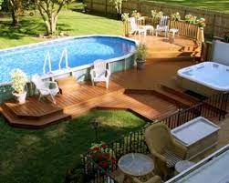 An outdoor, poolside kitchen has so many benefits, and can really add to the fun and enjoyment you already get from your pool. 12 Above Ground Swimming Pool Designs Above Ground Pool Landscaping Backyard Pool Pool Landscaping