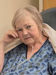 Can someone edit this photo of my mom to remove the hospital setting and  nasal canula?