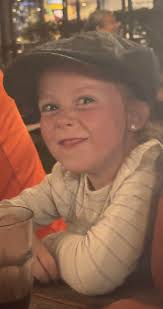 Can someone remove the orange in his hands and kid in background