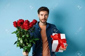 It's sweet to be with you. Romance And Valentines Day Man Presenting Bouquet Of Red Roses Stock Photo Picture And Royalty Free Image Image 162618011