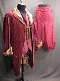 Men's late colonial sewing pattern for fall front breeches, with front pockets, optional waistband watch pocket and tabs for knee buckles. 18th Century Coat 18th Century Men 48port Magenta Burgundy Brown Bronze Stripe Brown Velvet Lapel And Cuffs Frog Closure With Tassels Pockets With Flaps And 3 Buttons Center Back Vent With Back
