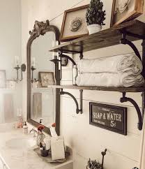 What A Stylish Bathroom View Filled With Charming Vintagestyle Style Farmhouse Fresh Vibes Our Mirror Adds A In 2020 Bathroom Style Towel Rack Bathroom Makeover
