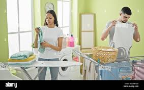 Family folding clothes hi-res stock photography and images