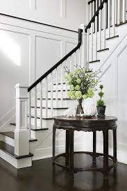 Both 42 and 48 tables would mean the chairs extending into the living area a bit. Wainscoted Staircase Wall With Round Foyer Table Transitional Dining Room Foyer Furniture Foyer Staircase Foyer Decorating