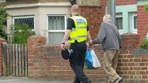 This photo of a police officer helping an elderly man will warm your heart