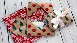 Next, take some thin cardboard or chipboard and glue the sleeve to it so it's sturdy. Holiday Card Series 2016 Day 5 Diy Gift Card Holder Made From Wrapping Paper Christmas Gift Card Christmas Gift Card Holders Diy Holiday Gifts