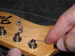 If your electric guitar strings look dirty, consistently sound dull or have broken, it might be time to change them. How To Change Guitar Strings On Fender Style Guitars