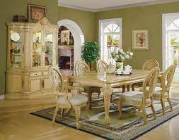 Casual vs formal dining rooms. Antique White Formal Dining Room With Carving Details