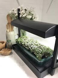 The sturdy recycled plastic base acts as a reservoir for water. Led Table Top And Self Watering Garden Grow Light Garden Outside The Box