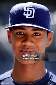 Dan Uggla of the Atlanta Braves connects for a three-run homer during...  News Photo