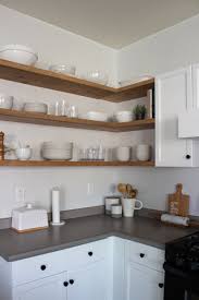 Install a lamp to one side using durable hardware and cut a slit on another side to let it serve as a phone docking station too. Diy Floating Corner Shelves In Kitchen Designed Simple