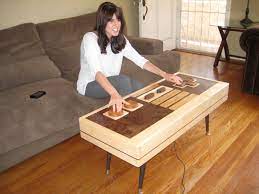 This living room set is ready to wire : Geek Gifts Vhs And Fully Functional Nintendo Controller Coffee Tables