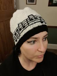 Knitted in secret as a Christmas gift for my musician husband. Modelled by  my daughter. Yet to be blocked.