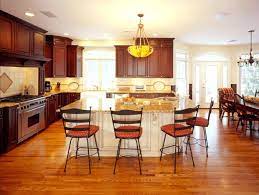 It pairs perfectly with the beige crown molding and trim. Cherry Cabinetry With Accent Color Island Home Kitchens Cabinetry Custom Cabinetry