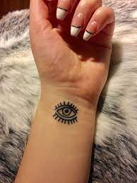 Her band pvris was on tour in san antonio, tx so they met up with local artist mason chimato, who also gave drummer justin nace a tattoo of roman numerals on his wrist. Tattoo Minimalisttattoos Evileye Eye Smalltattoo Wristtattoo Third Eye Tattoos Tattoos Black Tattoos