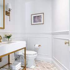 Like, take out and rebuild walls and cut out the plywood floor and move plumbing and drains and vents kind. White Bathroom With Gold Fixtures Design Ideas