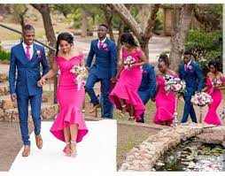 Are you thinking that pink and black are nice color to combine for wedding dresses? Image May Contain 4 People People Standing And Outdoor Fuschia Bridesmaid Dresses Wedding Dress Organza African Wedding Attire