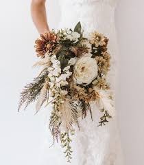 Arrange the other flowers one by one around the center flowers to create a dome shape. Pin By Brittany Schafer On Journey Of I Do Bohemian Wedding Bouquet Bohemian Wedding Wedding Bouquets