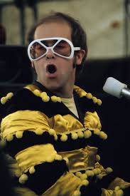 He's a british icon who is a singer, songwriter, pianist and composer. Elton John Sunglasses Photos 50 Years Of Elton John S Fabulously Over The Top Sunglasses